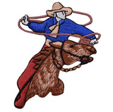 Embroidered patch depicting a cowboy on a horse with a lasso.