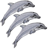 Three embroidered patches depicting dolphins in a marine theme. Each patch is designed to be iron on applied.