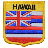 A shield-shaped embroidered patch with the text 'HAWAII' at the top and the flag of Hawaii design within the shield. 