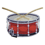 A patch depicting a snare drum with drumsticks on top, primarily red with white and gray accents.