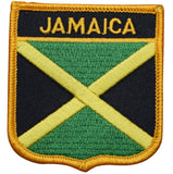 A shield-shaped embroidered patch with the text 'JAMAICA' and the colors of the Jamaican flag