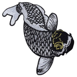 A embroidered black and white koi fish applique patch with a yellow spot on its head.
