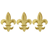three gold fleur de lis applique patches on a white background