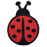 A red and black embroidered ladybug patch with a dotted pattern and antenna.