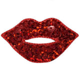 A sequin applique patch in the shape of lips with a red lipstick badge in the center