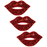 Three red sequin lip applique patches with an iron on backing, designed to resemble lips with lipstick.