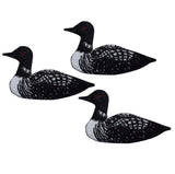 Three embroidered patches depicting a loon bird, with black and white plumage and red eyes