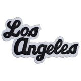 A patch with the text 'Los Angeles' embroidered in black and white.