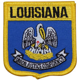 A shield-shaped embroidered patch with a blue background, yellow border, and featuring an emblem with a bird and the text 'LOUISIANA'.