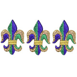 Three embroidered fleur-de-lis applique patches in purple and green with metallic gold accents, designed for iron-on application.