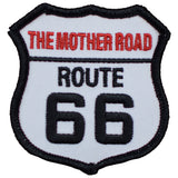 A shield-shaped patch with 'The Mother Road Route 66' text in red and black on a white background.