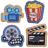 A set of four embroidered patch badges with movie-themed designs, including a projector, popcorn, film reel, and clapperboard, all with an iron-on application.