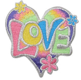 A colorful embroidered patch with the word 'LOVE' formed in a heart shape, surrounded by daisy flowers.