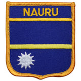 A patch representing the flag of Nauru with a blue background, yellow border, and the Nauru text in the top white border.