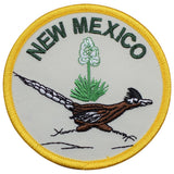 A round patch featuring an illustration of a roadrunner with 'NEW MEXICO' text and a cactus design, bordered by a yellow line.