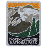 A rectangular embroidered patch featuring mountain ranges and trees with the text 'North Cascades National Park'.