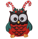 A Christmas owl applique patch with candy cane antlers and red and green holiday-themed embroidery.