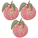 Three peach-shaped embroidered patches with a sparkly pink texture, green leaves, and brown stems