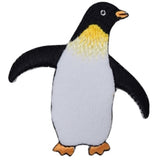 A fabric patch depicting a black and white king penguin with yellow around the neck.