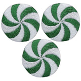 Three circular embroidered patches with a peppermint candy design, in green and white, with an iron-on application.