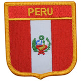 A shield-shaped embroidered patch with the flag of Peru design, including the coat of arms, with a red and white vertical stripe, and the text 'PERU' at the top.