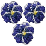 Three embroidered patches depicting purple pansy flowers with a yellow center, designed with an iron-on application.