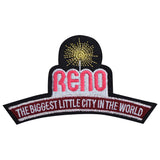 An applique patch with the text 'RENO THE BIGGEST LITTLE CITY IN THE WORLD' on it, predominantly red and black with a gold starburst.