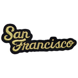 Embroidered patch with the text 'San Francisco' in a cursive gold/black script on a white background.