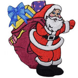 Embroidered patch of Santa Claus carrying a bag of toys and presents, designed for iron on application.