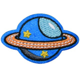 A patch depicting a stylized version of the planet Saturn with a blue background, orange rings, and yellow stars.