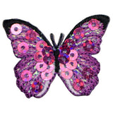 A pink fuchsia butterfly applique patch with mini sequin embellishments and an iron-on backing.