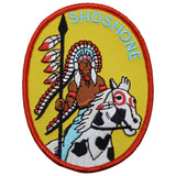 Patch with an illustration of a Native American chief on a horse, labeled 'Shoshone', on a blue white background.