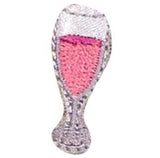 A patch depicting a sparkling wine glass filled with pink liquid, embroidered in gray and pink colors with a 'Iron on' backing.