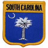 A shield-shaped patch with a blue field featuring a white palmetto tree and a crescent moon. The words 'SOUTH CAROLINA' are written across the top in bold white letters.