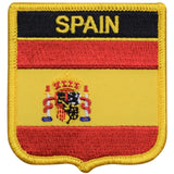 A shield-shaped embroidered patch with the Spain flag colors and the coat of arms of Madrid.