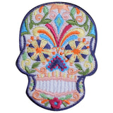 A patch in the shape of a sugar skull with a colorful floral pattern.