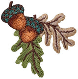 Embroidered patch depicting an acorn and oak leaves on a white background
