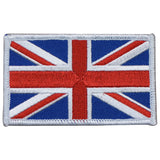 A patch with the design of the GB flag, also known as the UK badge, with a red cross on a white and blue background, designed to be ironed onto fabric.