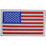 A patch with the design of the United States of America flag, featuring red and white stripes with a blue field and white stars.
