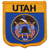 A shield-shaped embroidered patch with a blue field and gold trim. The patch features the Utah state emblem with the name 'UTAH' across the top and the date '1896' at the bottom.