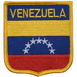 A shield-shaped embroidered patch with the text 'Venezuela' and the flag of Venezuela's coat of arms, featuring yellow, blue, and red colors with white stars.