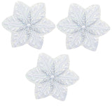 Three white snowflake applique patches with an iridescent finish, designed to be ironed onto fabric.