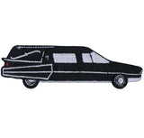 A black and white embroidered patch in the shape of a hearse.