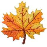 Embroidered patch of an orange and yellow leaf with brown veins on a white background.